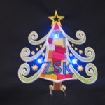 Special Christmas embroidery made with the ZSK embroidery machine. Special conductive threads are used for this; an LED light is making the embroidery shine