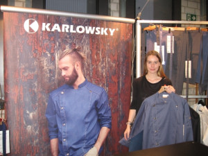 Josie Reutes, Marketing coordinator at Karlowsky Fashion GmbH shows the new Chef Jacket Jeans 1892 Tennessee
